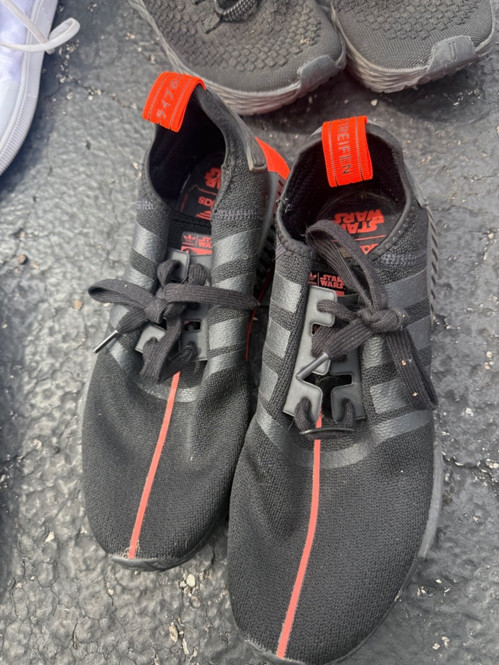 adidas Black Slip-On Sneakers with Red Accent Stripe
